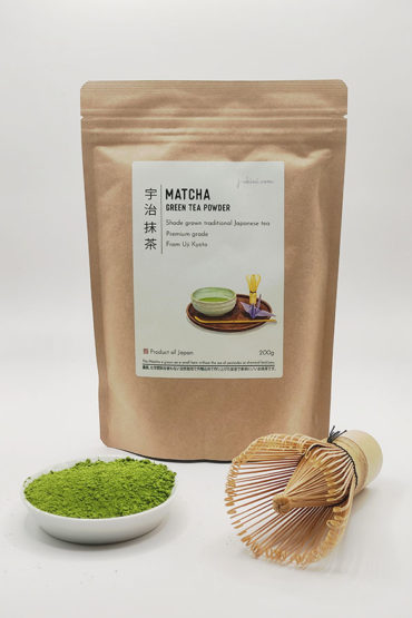 Premium grade Japanese Matcha powder in a dish with a bamboo whisk, alongside J-okini’s 200g Matcha package. Pesticide-Free. Great for traditional tea, Matcha lattes, and Matcha sweets. Reasonably priced for everyone. Available at j-okini.com in Malta