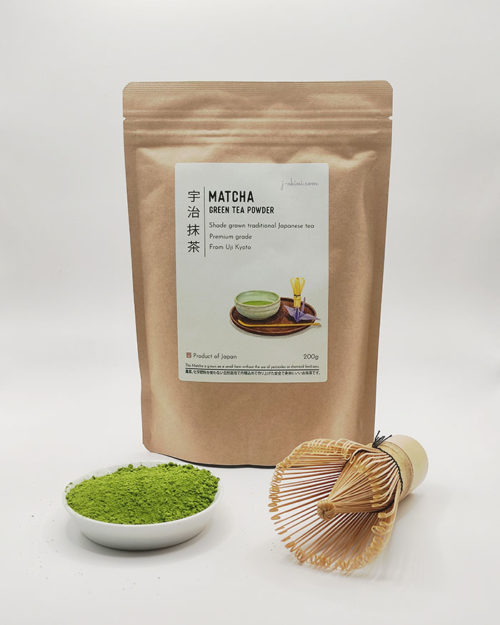 Premium grade Japanese Matcha powder in a dish with a bamboo whisk, alongside J-okini’s 200g Matcha package. Pesticide-Free. Great for traditional tea, Matcha lattes, and Matcha sweets. Reasonably priced for everyone. Available at j-okini.com in Malta