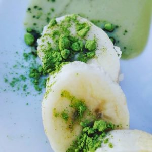 Matcha green tea powder on banana