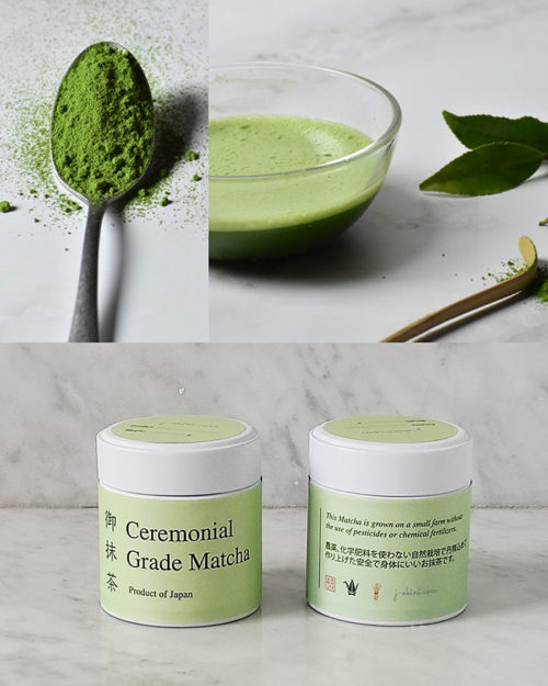 Ceremonial grade matcha with a Matcha powder in a spoon, prepared Matcha and Matcha tins