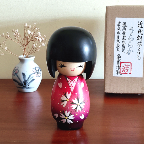 Handcrafted Japanese Kokeshi doll in traditional Sakura kimono, featuring intricate details and vibrant colors, perfect for cultural collectors and home decor Malta