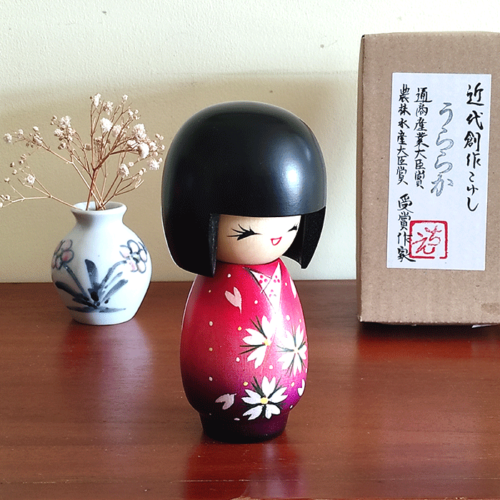 Handcrafted Japanese Kokeshi doll in traditional Sakura kimono, featuring intricate details and vibrant colors, perfect for cultural collectors and home decor Malta