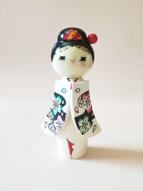 Japanese Kokeshi Doll Sakura Komachi with a red Kanzashi and long sleeves with Sakura pattern