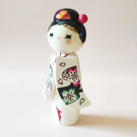 Handcrafted Japanese Kokeshi doll 'Sakura Komachi' by artist Yamagishi Masayoshi, featuring a kanzashi hair bun and a kimono with hand-painted pink and blue cherry blossoms. Available at j-okini.com in Malta