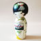 Hand-painted Japanese Kokeshi doll with Tanzaku festival design and silver obi. Buy it at j-okini.com in Malta