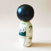 Tanabata Kokeshi doll by Oki Izumi with light summer kimono and Tanzaku pattern. Available at j-okini.com in malta