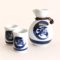 Japanese Seiji Mino ware sake set with 250ml sake bottle and two cups in pale blue celadon glaze