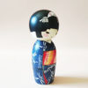 Hand-painted Japanese wooden doll Akikaze wearing bellflower hair ornament. Kokeshi dolls available at J-okini.com in Malta