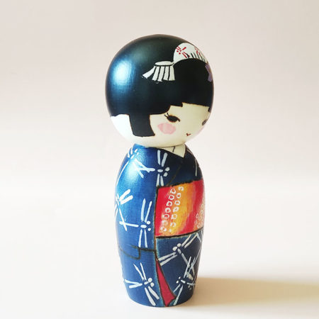 Hand-painted Japanese wooden doll Akikaze wearing bellflower hair ornament. Kokeshi dolls available at J-okini.com in Malta