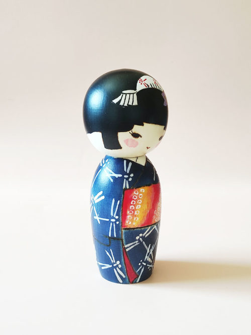 Hand-painted Japanese wooden doll Akikaze wearing bellflower hair ornament. Kokeshi dolls available at J-okini.com in Malta
