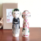 This 近代創作こけし modern creative Kokeshi doll is called '祝福 Shukufuku' and it was created by an award-winning artist  ‘関口東亜 Sekiguchi Toua‘. '祝福 Shukufuku' means 'celebration'.   The couple is wearing Japanese traditional wedding Kimono symbolizing love, unity, and cultural heritage.. Looking for a unique and meaningful gift for a couple who adores Japan? Why not choose '祝福 Shukufuku'? It's not just a gift; it's a gesture that celebrates love, tradition, and the artistry of Japan. Available at j-okini.com in Malta
