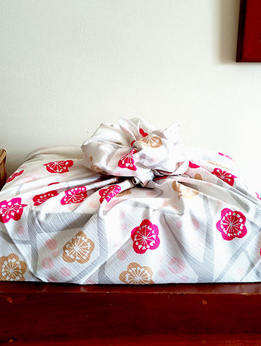 90cm Furoshiki wrapping cloth Edaume wapped in a flower knot. Available at j-okini malta