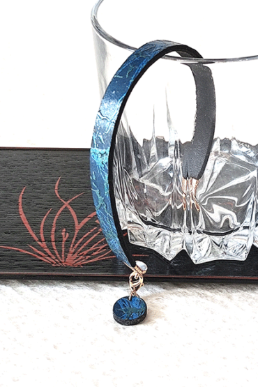 Ocean Twilight Japanese handmade leather bracelet with a textured deep blue and blue-green pattern, featuring a matching charm and magnetic clasp. Made in Japan. Gifts from Japan. j-okini.com in Malta