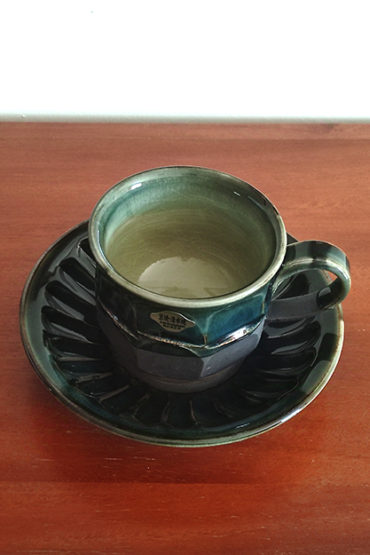 Handmade Kiyomizu Ware Coffee Cup and Saucer Set in deep Oribe green by Ando Mitsuru, showcasing texture contrasts and traditional Japanese craftsmanship.. Buy it from j-okini in Malta