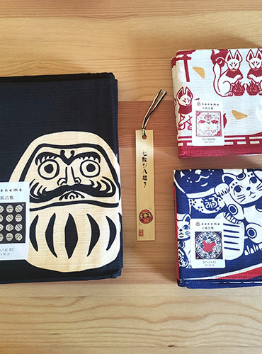 Large daruma furoshiki, small inari Kitsune furoshiki and Manekineko, Nanakorobi yaoki bamboo bookmark