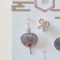 Japanese earring set including two mini uchiwa fan featuring a vibrant fireworks (hanabi) pattern earrings with hooks , paired with a cute ribbon stud earring. Uchiwa fan has the desi Made in Japan! Available at j-okini.com in Malta