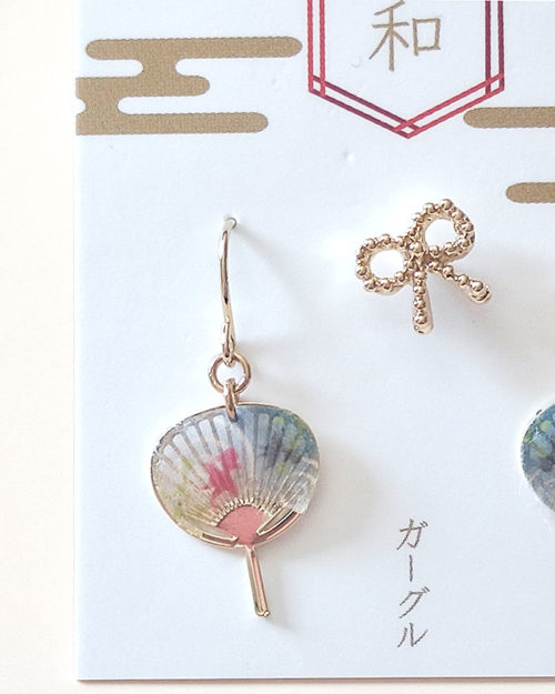 Japanese earring set including two mini uchiwa fan featuring a goldfish motif earrings with hooks , paired with a cute ribbon stud earring. Uchiwa fan has the desi Made in Japan! Available at j-okini.com in Malta