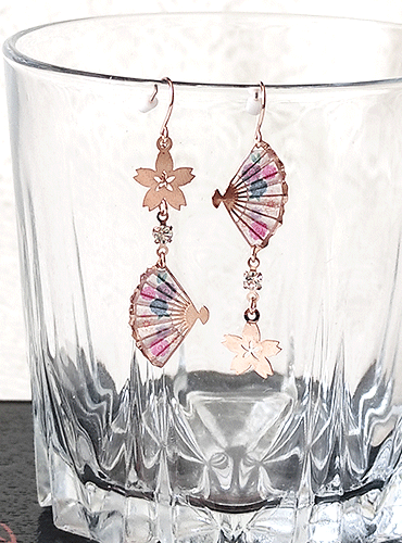 Japanese earrings with a graceful design of Sakura (cherry blossoms) and Sensu fans, elegantly connected in a vertical arrangement. Available at j-okini.com in Malta