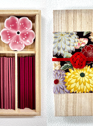 Japanese Sakura incense gift set in a premium paulownia wood box and accompanied by a sakura-shaped incense holder. Wrapped with a Kiku pattern fabric and tied with Mizuhiki. Available at j-okini.com in Malta