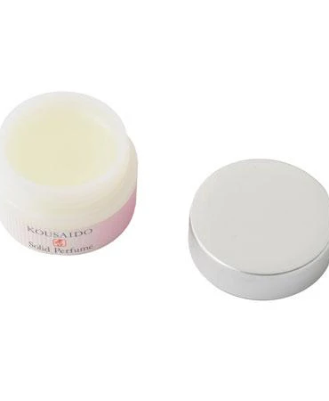 Compact container of Hagoromo solid perfume with a fruity floral fragrance, inspired by cherry blossoms and traditional Japanese zukō scent rituals. Made with natural oils, gentle on skin, ideal for travel and gifting. j-okini in Malta