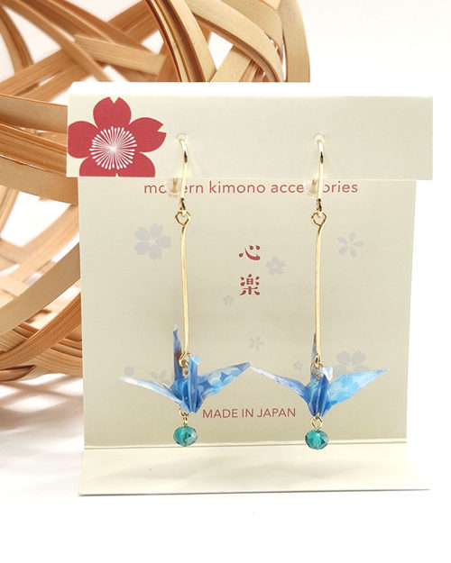 Elegant earrings featuring light blue Chiyogami paper with a Tsuru crane motif, accented by a light blue glass bead, symbolizing peace and longevity. Gift idea from j-okini.com in Malta