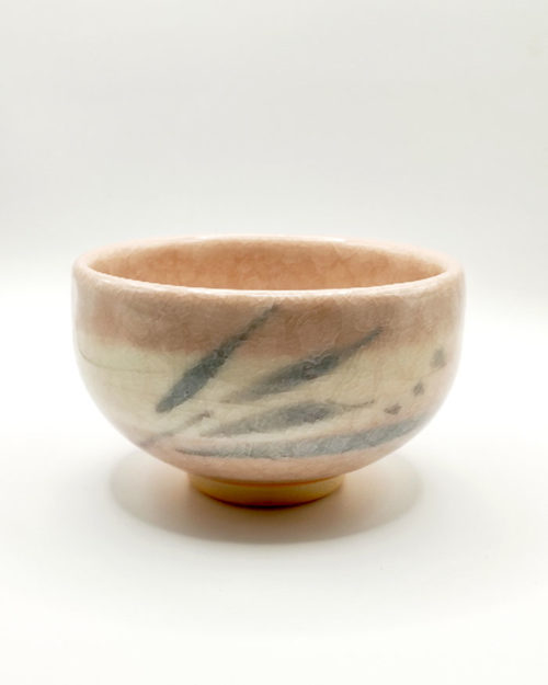 Kiyomizu-ware handmade Matcha bowl by Okayama Kousha, featuring a warm light coral and skin-tone hue with a delicate cracked-glass pattern. Tube-shaped for excellent heat retention, with unique random grey accents on the front. Stamped at the bottom. Made in Japan. Available at j-okini.com in Malta