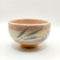 Kiyomizu-ware handmade Matcha bowl by Okayama Kousha, featuring a warm light coral and skin-tone hue with a delicate cracked-glass pattern. Tube-shaped for excellent heat retention, with unique random grey accents on the front. Stamped at the bottom. Made in Japan. Available at j-okini.com in Malta