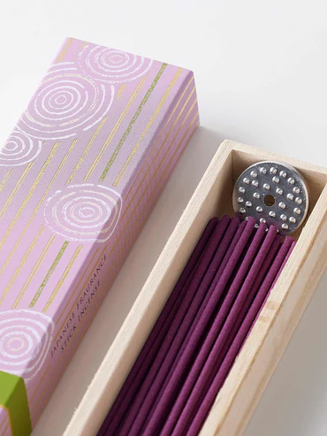 A box of high-quality Kyoto incense featuring a lotus fragrance. The packaging showcases elegant Japanese design, and the set includes long incense sticks along with a small incense stand. Ideal for creating a calming and fragrant atmosphere. Available at j-okini.com in Malta