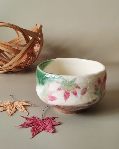 Small Mino Ware Matcha bowl with a cream base and colorful Momiji (Japanese maple leaves) design, handmade in Gifu, Japan. Available at j-okini.com in Malta