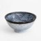 A traditional Japanese Mino ware donburi bowl featuring a deep blue Seigaiha wave pattern. With a 600ml capacity, 16cm diameter, and 8cm height, it's ideal for rice dishes, udon, or instant noodles. Beautifully crafted with a smooth glaze, showcasing the elegance of Japanese ceramics. Made in Japan. Available at j-okini.com in Malta