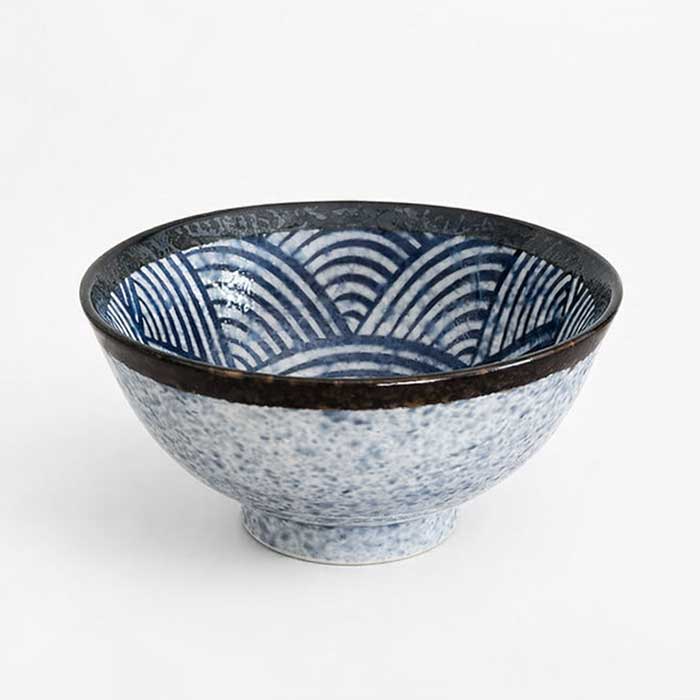 A traditional Japanese Mino ware donburi bowl featuring a deep blue Seigaiha wave pattern. With a 600ml capacity, 16cm diameter, and 8cm height, it's ideal for rice dishes, udon, or instant noodles. Beautifully crafted with a smooth glaze, showcasing the elegance of Japanese ceramics. Made in Japan. Available at j-okini.com in Malta