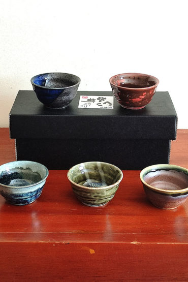 A set of five uniquely glazed Japanese sake cups, each with a different color and finish. Perfect for entertaining or gifting. Made in Japan. Available at j-okini.com in Malta