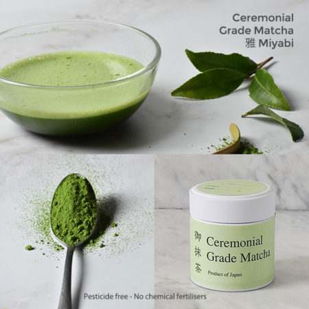 Ceremonial grade matcha with a Matcha powder in a spoon, prepared Matcha and Matcha tins