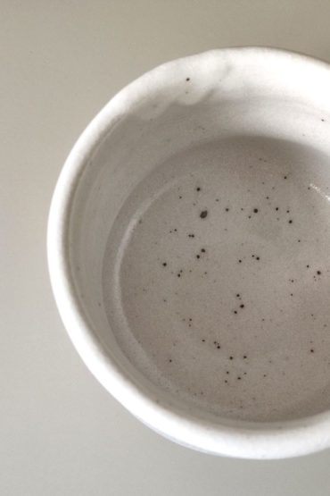 Interior view of Japanese Mino ware white Shino Matcha bowl with subtle speckled glaze, handcrafted ceramic tea bowl. Available at j-okini.com in Malta