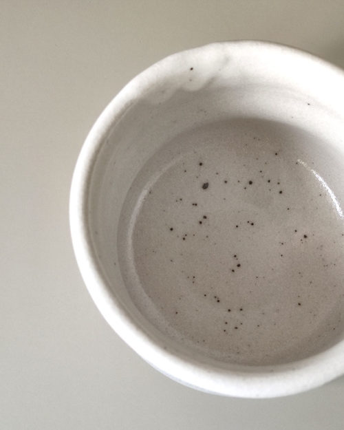 Interior view of Japanese Mino ware white Shino Matcha bowl with subtle speckled glaze, handcrafted ceramic tea bowl. Available at j-okini.com in Malta