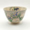 Kiyomizu ware matcha bowl with iris flowers, golden accents, and Gohonte pink blush, handcrafted by Kahou Nakamura II of Tofuku Kiln. j-okini.com in Malta