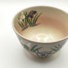 Kiyomizu ware matcha bowl with iris flowers, golden accents, and Gohonte pink blush, handcrafted by Kahou Nakamura II of Tofuku Kiln.