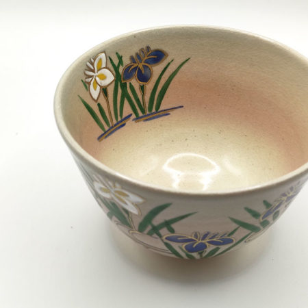 Kiyomizu ware matcha bowl with iris flowers, golden accents, and Gohonte pink blush, handcrafted by Kahou Nakamura II of Tofuku Kiln.
