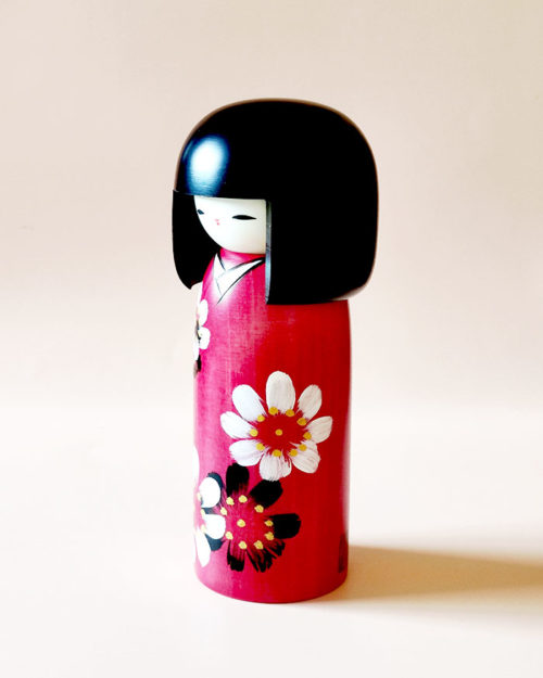 Handmade Hana Guruma wooden Kokeshi doll in floral dark red kimono by Japanese artist Usaburo.. Order online at j-okini.com in Malta