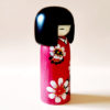 Japanese Kokeshi doll Hana Guruma with hand-painted floral kimono, modern creative design by Usaburo.. Buy it online at j-okini.com in Malta