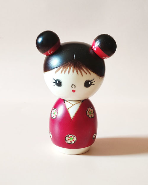 Mujaki modern creative Kokeshi doll in red floral kimono with odango hairstyle, handmade in Japan by award-winning artist Chie.. Buy it online at j-okini.com in Malta