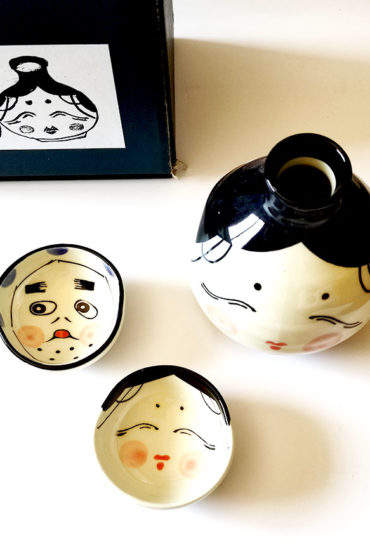 Okame and Hyottoko sake cups with matching tokkuri flask. Available at j-okini.com in Malta