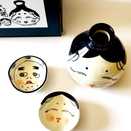 Okame and Hyottoko sake cups with matching tokkuri flask. Available at j-okini.com in Malta