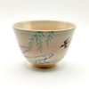 Kiyomizu-ware matcha bowl “Yanagi to Tsubame” by Kahou Nakamura, featuring willow tree, sparrow in flight, flowing waves, gold details, and natural Gohonte patterns. j-okini..com in Malta