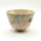 Kiyomizu-ware matcha bowl “Yanagi to Tsubame” by Kahou Nakamura, featuring willow tree, sparrow in flight, flowing waves, gold details, and natural Gohonte patterns. j-okini..com in Malta