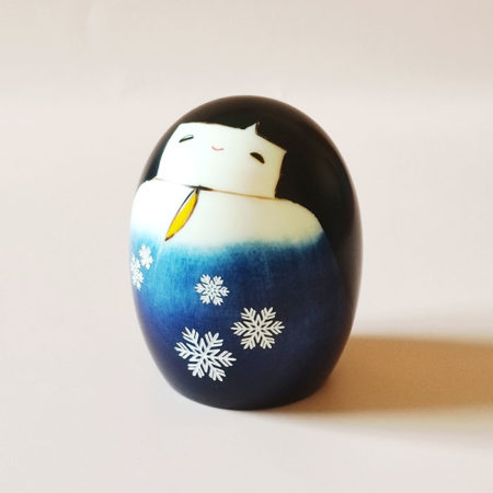 Small egg-shaped Japanese Kokeshi doll Yuki no Sei with smiling face and winter-themed kimono by Usaburo.. j-okini.com in Malta