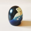 Handmade wooden Kokeshi doll Yuki no Sei in blue snowflake kimono, modern creative design by Usaburo.