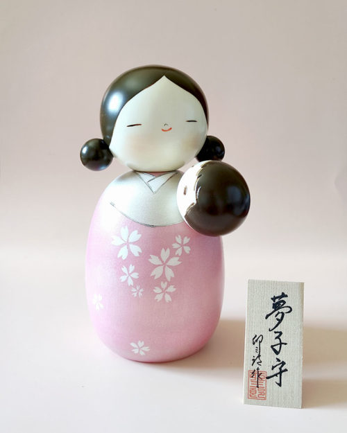 Japanese Kokeshi doll Yume Komori by Usaburo – large 19.5cm wooden doll of a mother holding a baby, with silver and sparkling pink haori decorated with cherry blossoms. j-okini.com in Malta