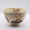 Vintage handmade Matcha bowl with kabuto samurai helmet and Japanese iris design, gold rim, signed by artist Tōsei.