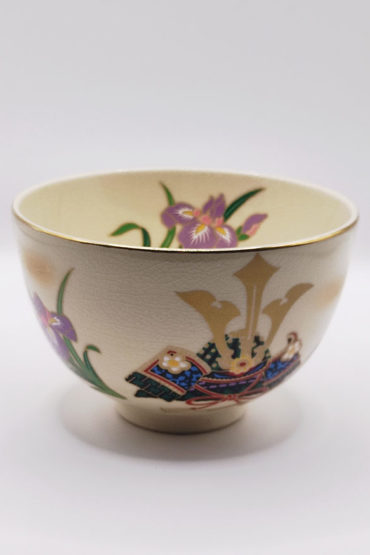 Vintage handmade Matcha bowl with kabuto samurai helmet and Japanese iris design, gold rim, signed by artist Tōsei.
